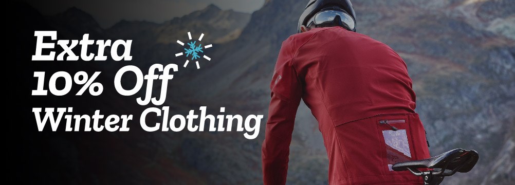 A road cyclist in cold conditions wearing Mavic cycle clothing